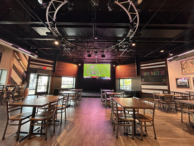 Large display screens and overhead lighting in a hospitality venue
